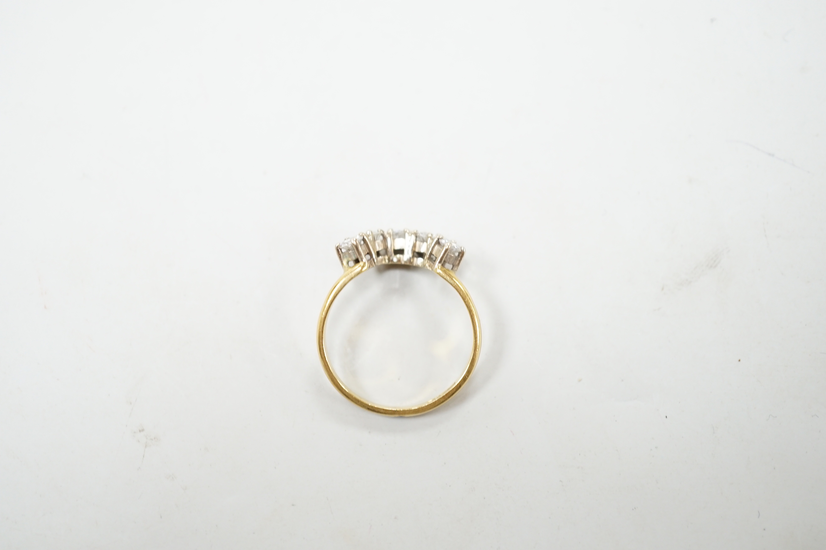 A modern 18ct gold and five stone diamond set demi-lune ring (part of a wedding set?) size M, gross 2.9 grams.